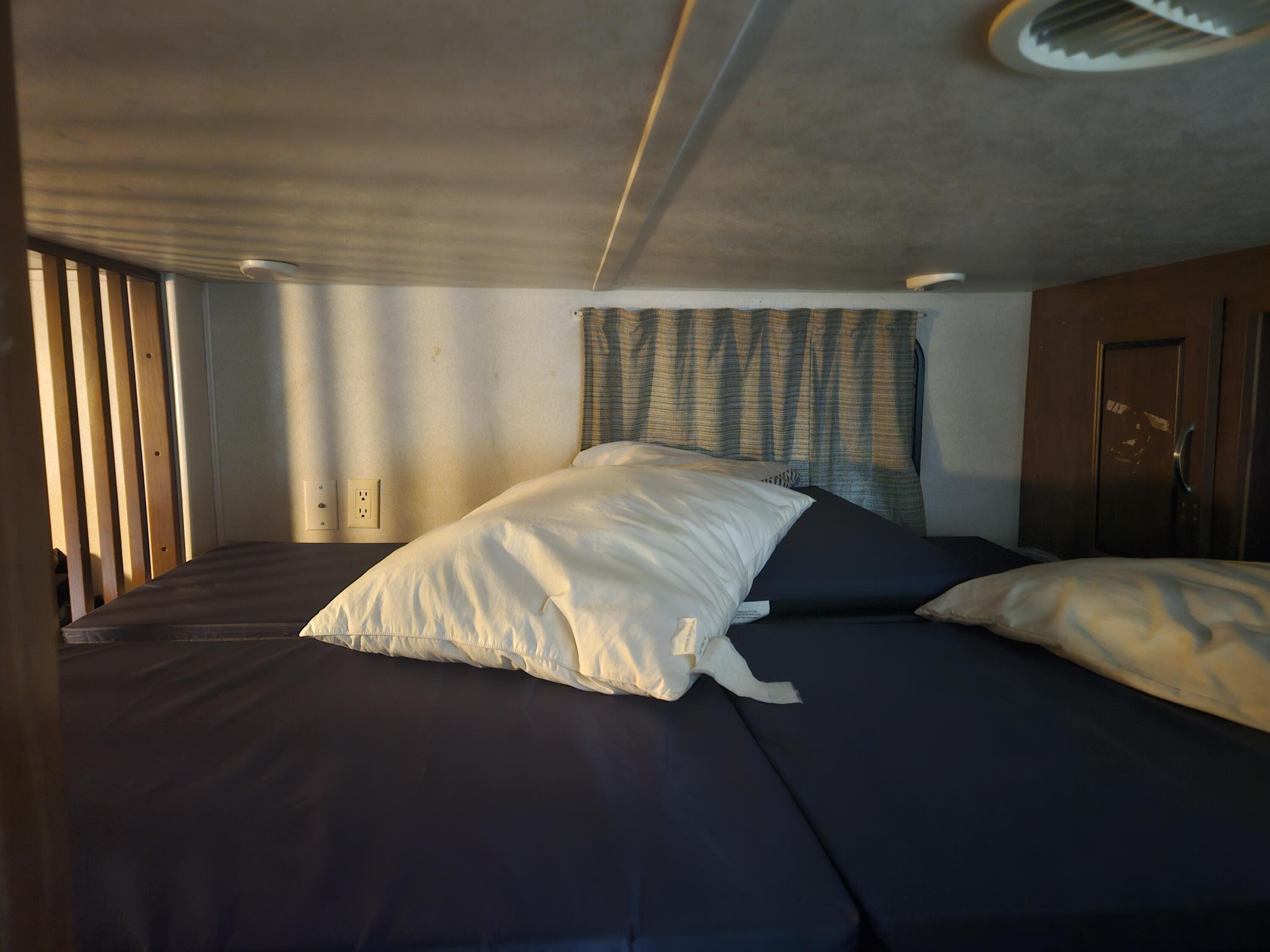 325 Calusa Street, Unit 259 Key Largo, FL 33037 - Photo 10 of 12 a bed sitting in a spacious bedroom next to a window