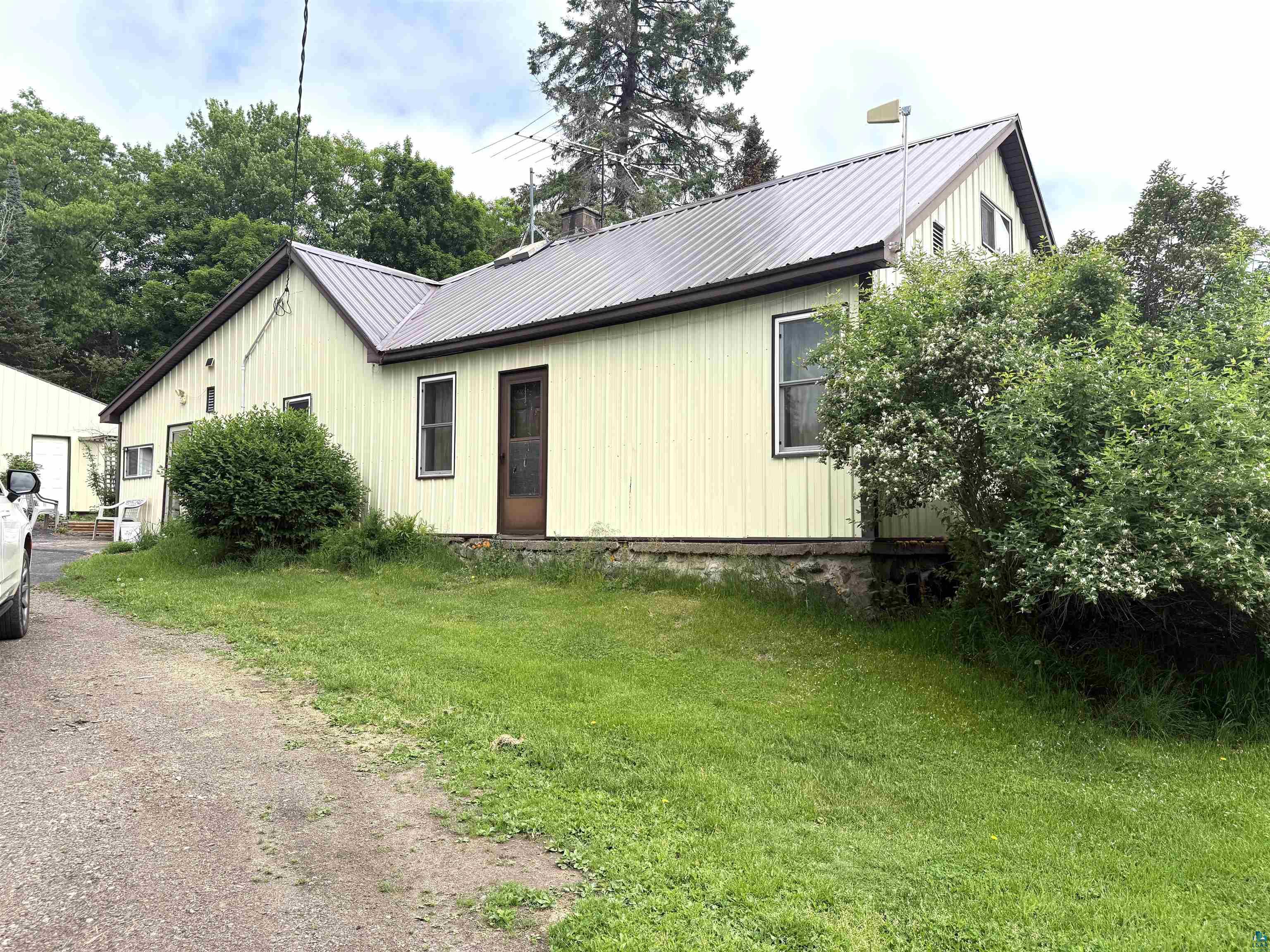 3541 Bent Trout Lake Road Barnum, MN 55707 - Photo 3 of 41 Exterior featuring vertical siding and a metal roof
