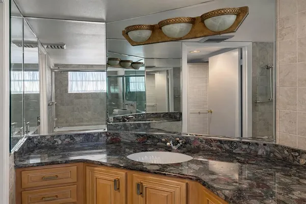 a bathroom with a shower and a toilet
