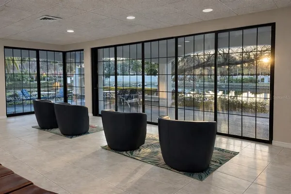 a view of a dining room with furniture and a flat screen tv