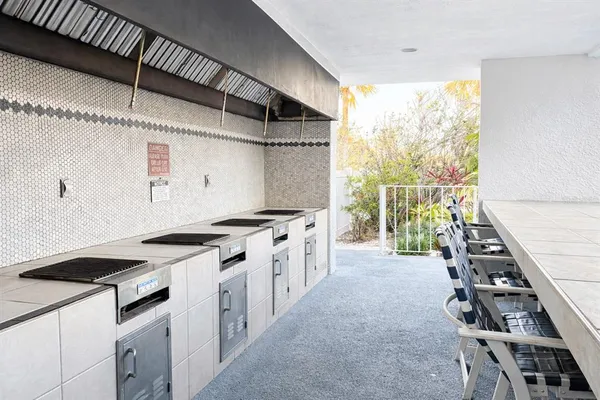 a view of swimming pool with seating space