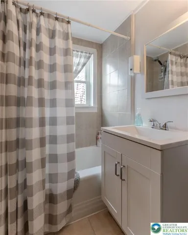 a view of room with workspace and windows