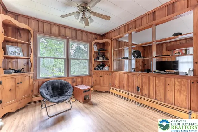 a living room filled with furniture and a chandelier