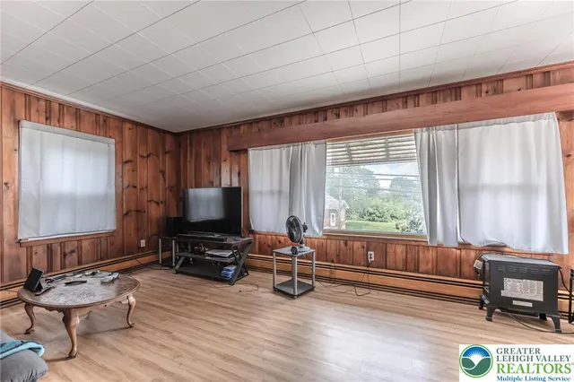 a kitchen with granite countertop a sink stainless steel appliances wooden cabinets and a window