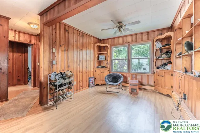 a bathroom with a granite countertop toilet sink and mirror