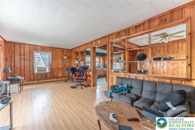 a living room with a couch and a window