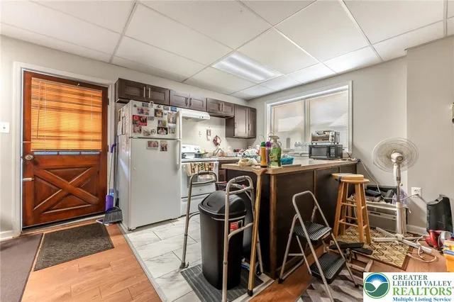 a bed room with a bed and a chair