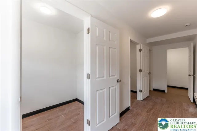 a view of an entryway with wooden floor
