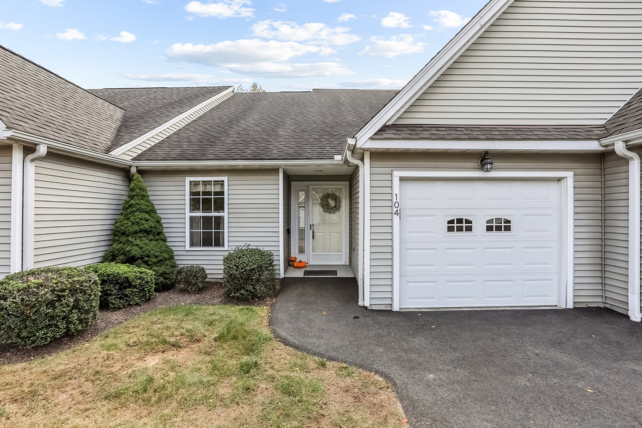 a front view of a house with garden