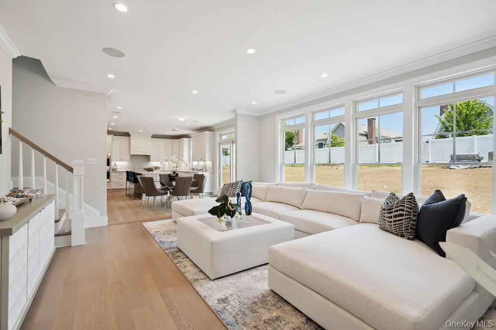 48 Plainview Road Woodbury, NY 11797 - Photo 12 of 49 a living room with furniture and a large window