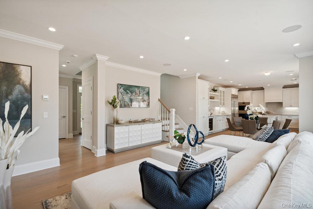 48 Plainview Road Woodbury, NY 11797 - Photo 13 of 49 a living room with furniture and a flat screen tv