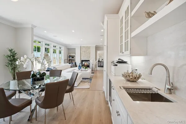 a kitchen with a sink a stove a counter space and cabinets