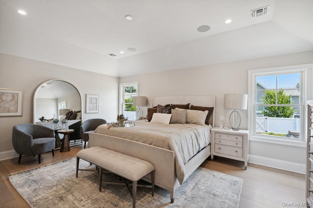 48 Plainview Road Woodbury, NY 11797 - Photo 26 of 49 a bedroom with a bed and a couch