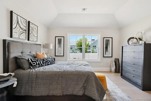 a bedroom with a bed and window