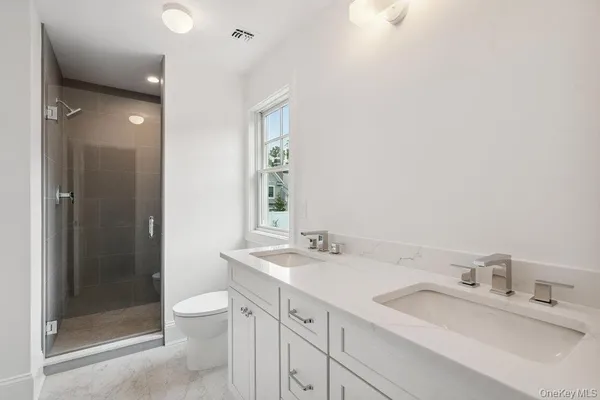 a en suite bathroom with a sink and a mirror