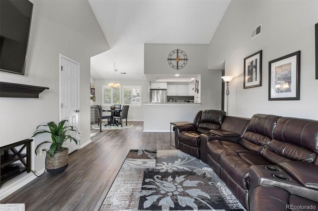 a living room with furniture or couch and a potted plant