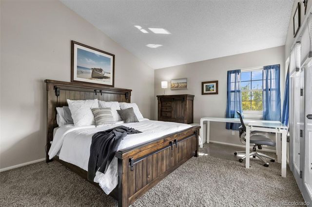 a bed room with a bed and furniture