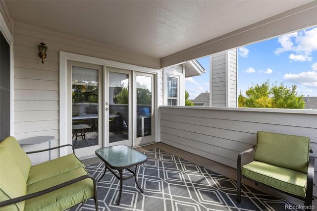 a view of a chairs and table in a patio