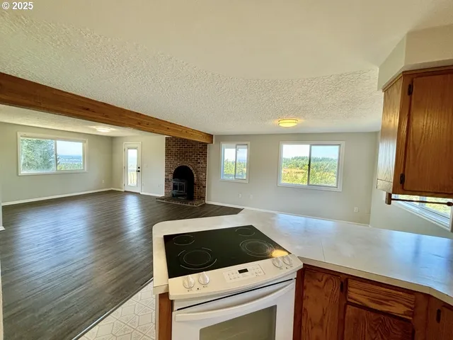 a living room with a fireplace furniture and a window