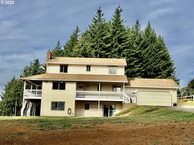 a view of house with yard