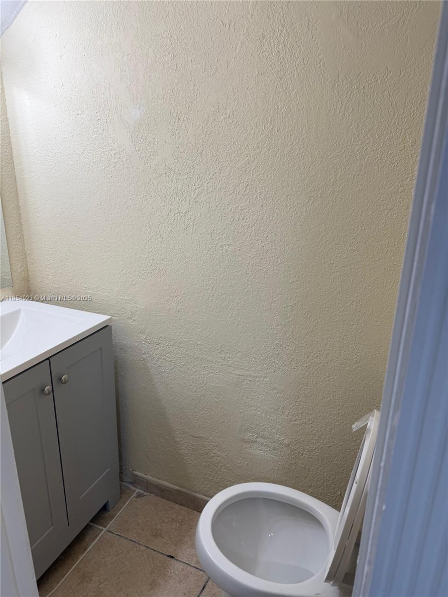 2310 West 60th Street, Unit 9G Hialeah, FL 33016 - Photo 12 of 15 a bathroom with a toilet and sink