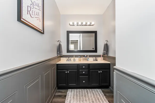 a bathroom with a sink and a mirror
