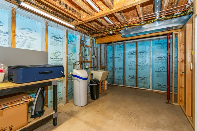 a view of a patio with a table and chairs