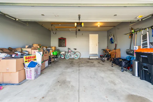 a view of a garage with rack and bicycle