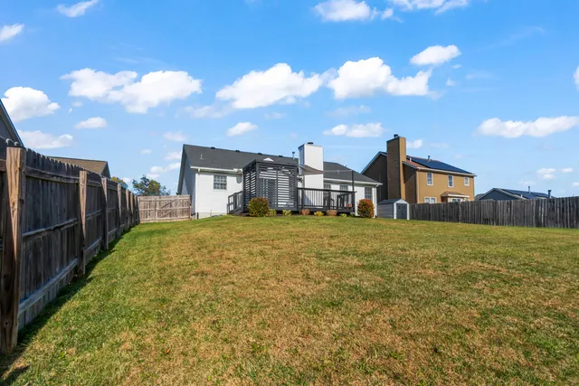 a yellow building with trees in front of it