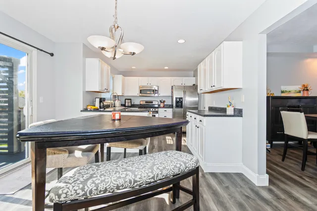 a view of kitchen with cabinets and wooden floor