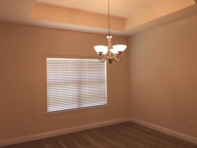624 Red Fern Road Crestview, FL 32536 - Photo 13 of 26 a view of a room with a chandelier fan and windows