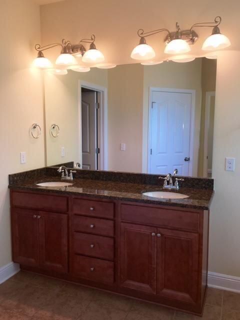 624 Red Fern Road Crestview, FL 32536 - Photo 15 of 26 a bathroom with a granite countertop sink and a mirror