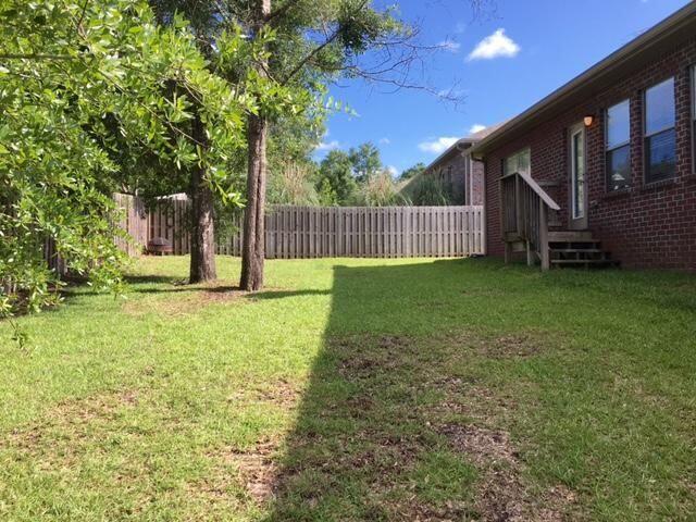 624 Red Fern Road Crestview, FL 32536 - Photo 18 of 26 a view of a house with backyard and porch