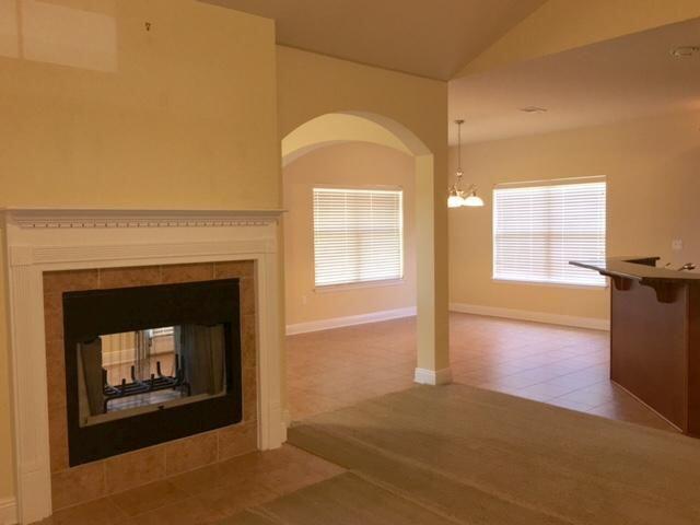 624 Red Fern Road Crestview, FL 32536 - Photo 4 of 26 a view of an empty room with a fireplace and a window