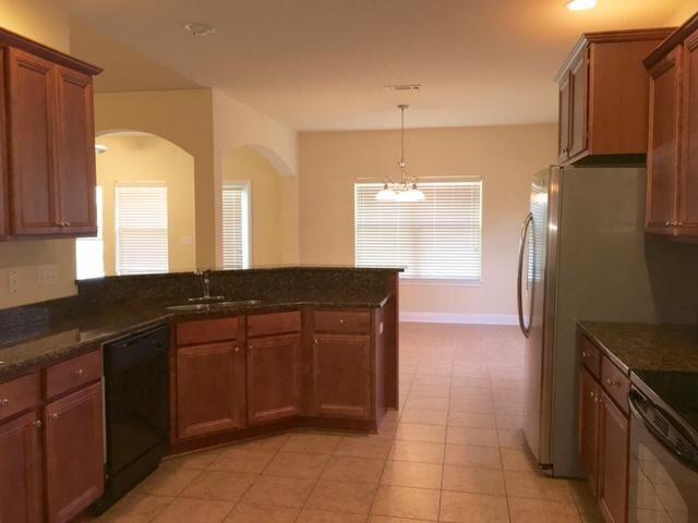 624 Red Fern Road Crestview, FL 32536 - Photo 8 of 26 a kitchen with a sink refrigerator and microwave