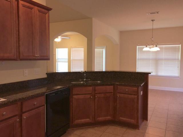 624 Red Fern Road Crestview, FL 32536 - Photo 9 of 26 a kitchen with a sink and cabinets
