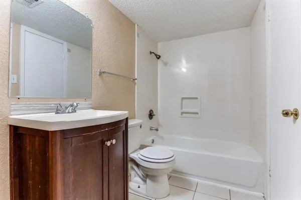 a bathroom with a sink a toilet and a bathtub