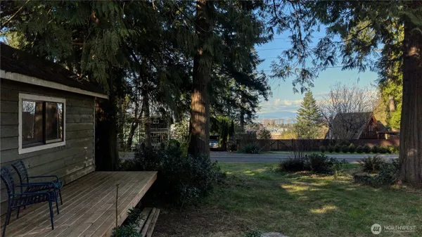 a view of house with backyard space and garden