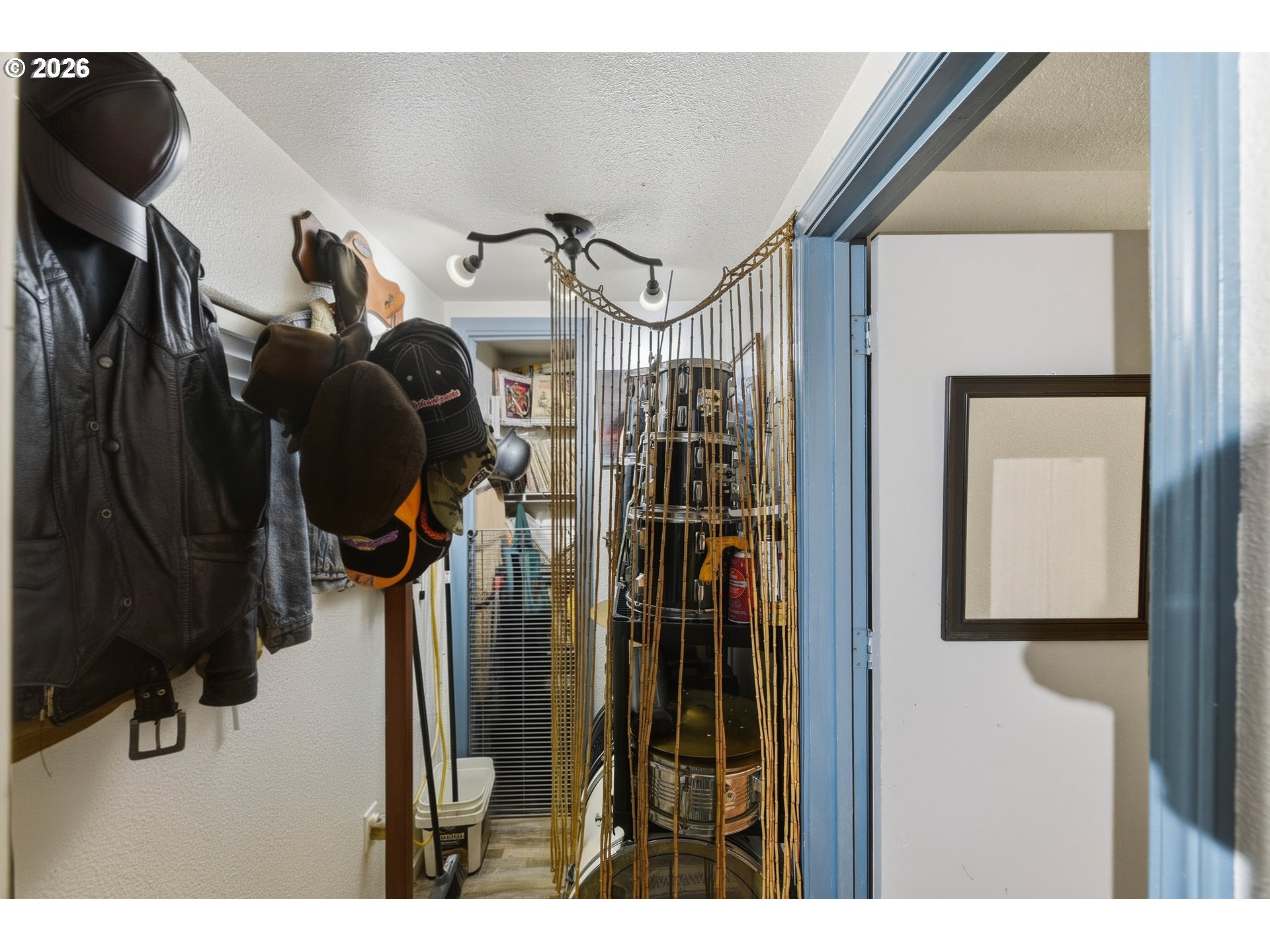 1955 Maple Street North Bend, OR 97459 - Photo 46 of 48 a view of walk in closet with clothes and shoes