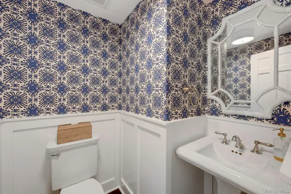 a bathroom with a sink and mirror