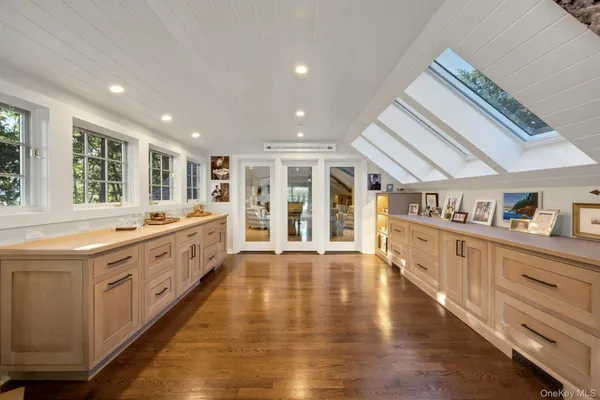 a large kitchen with stainless steel appliances granite countertop a large center island and a sink