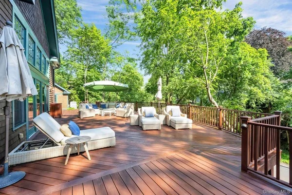 a view of a backyard with sitting area
