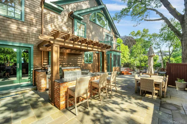 a view of a chairs and table in a patio