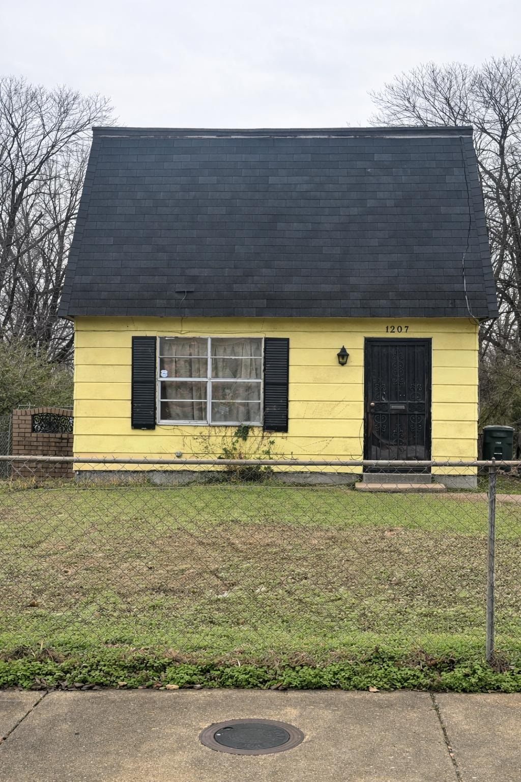 Cape cod house featuring roof with shingles