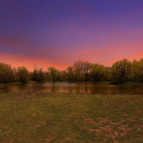 a view of lake with green space