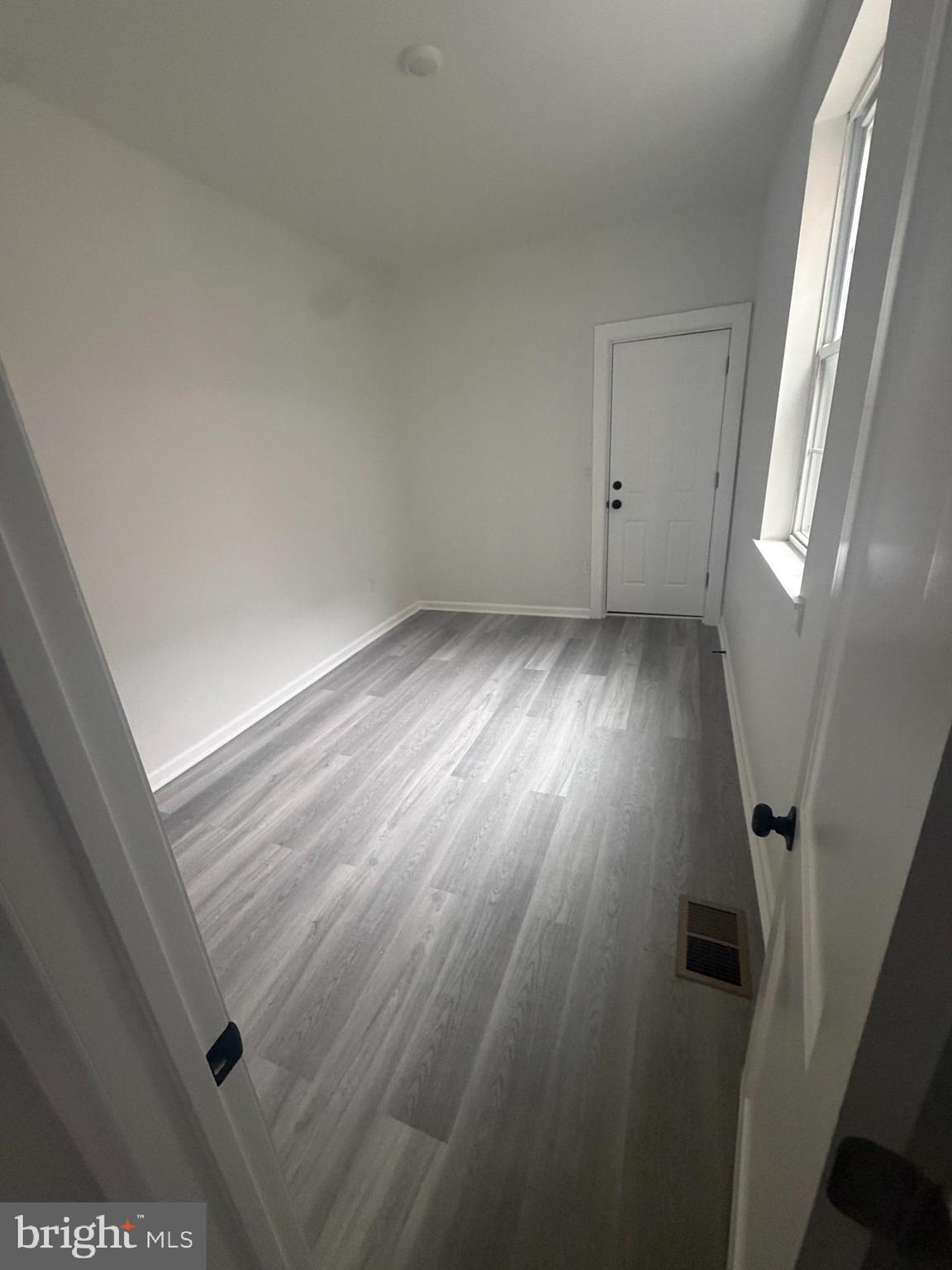 112 East Huntingdon Street, Unit 1 Philadelphia, PA 19125 - Photo 2 of 10 wooden floor in an empty room with a window