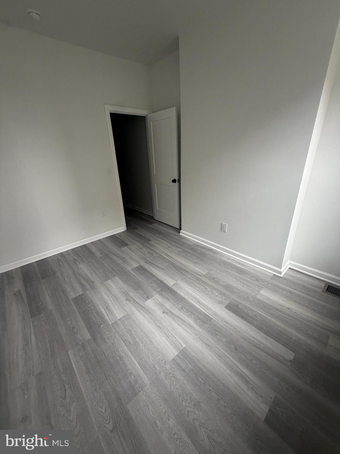112 East Huntingdon Street, Unit 1 Philadelphia, PA 19125 - Photo 4 of 10 a view of an empty room with wooden floor