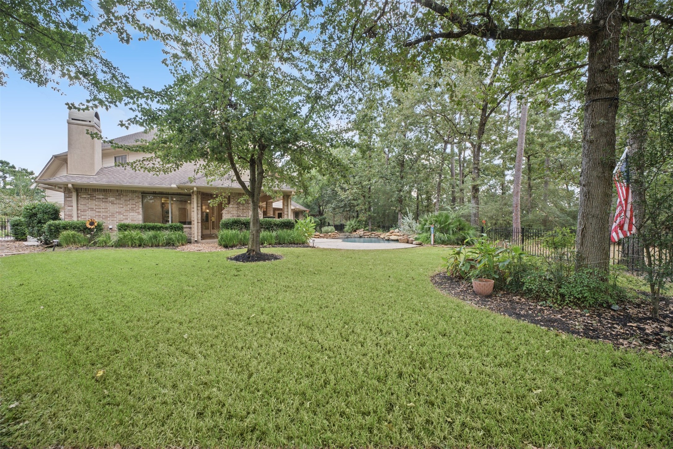 25119 Arcane Court Spring, TX 77389 - Photo 49 of 50 Room to Play—Without the Yard Work! Expansive areas of green grass in both the front and backyard provide plenty of room for kids, pets, and outdoor fun. Best of all, front and rear lawn mowing and edging are included in the HOA fees, leaving more time to simply enjoy the outdoors. Front and rear gutters provide efficient rainwater management, while the home is also wired for a generator, adding convenience and peace of mind when the unexpected happens.