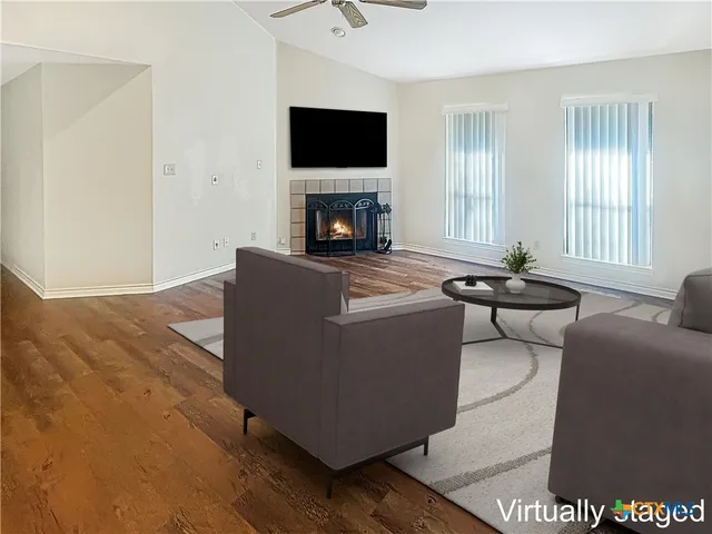 a living room with a couch and a flat screen tv