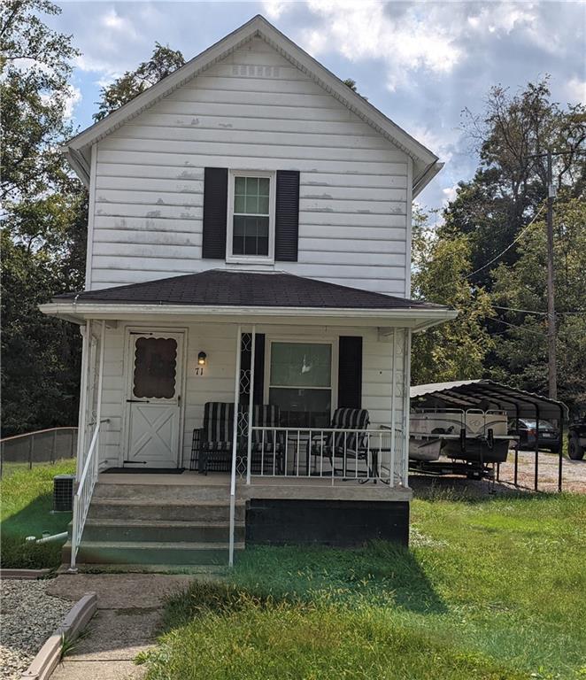 71 Blanche Road Fredericktown, PA 15333 - Photo 2 of 19 a view of a house with a yard and a large tree